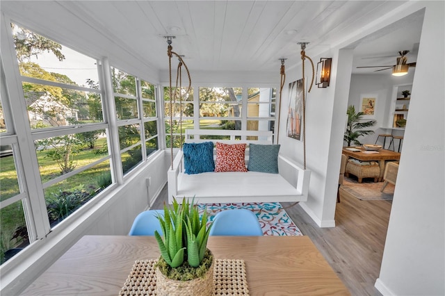 sunroom featuring a wealth of natural light and ceiling fan