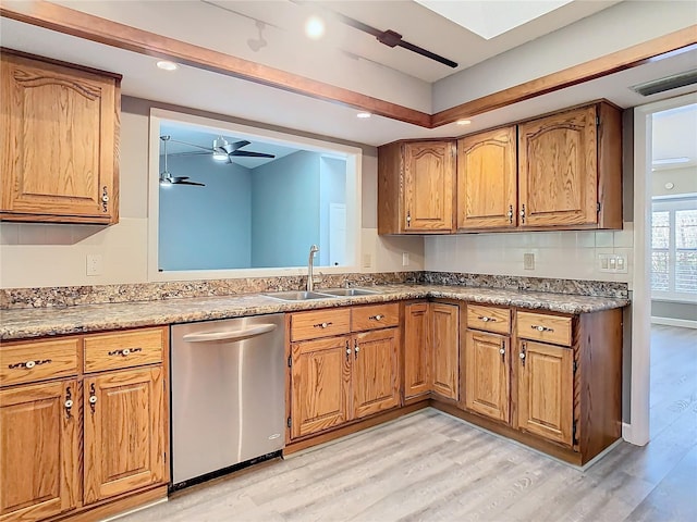 kitchen featuring ceiling fan, light wood-type flooring, sink, and dishwasher