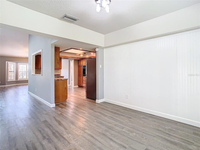 unfurnished room featuring hardwood / wood-style flooring