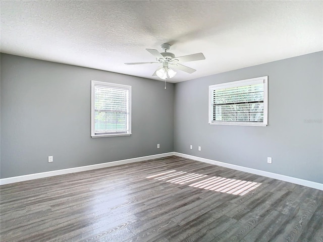 spare room featuring ceiling fan, a textured ceiling, and wood-type flooring