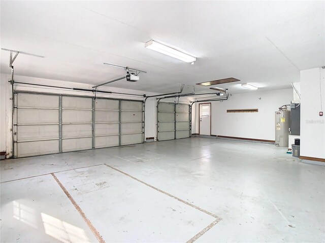 garage with a garage door opener and water heater