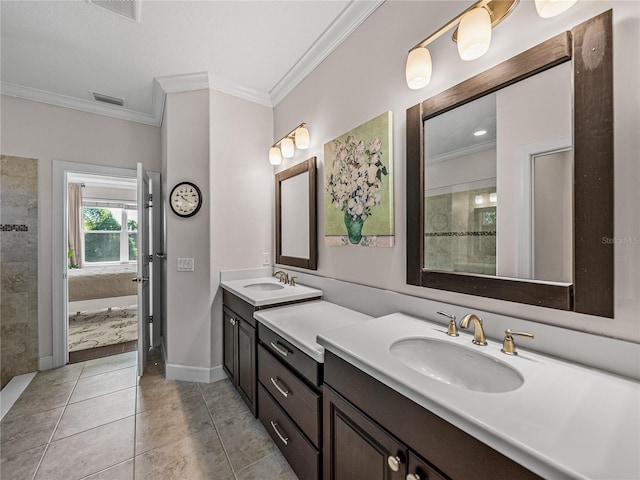 bathroom featuring tile patterned flooring, vanity, and crown molding