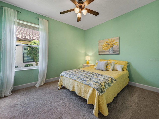 carpeted bedroom featuring ceiling fan