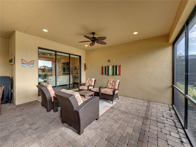 view of patio featuring an outdoor hangout area and ceiling fan