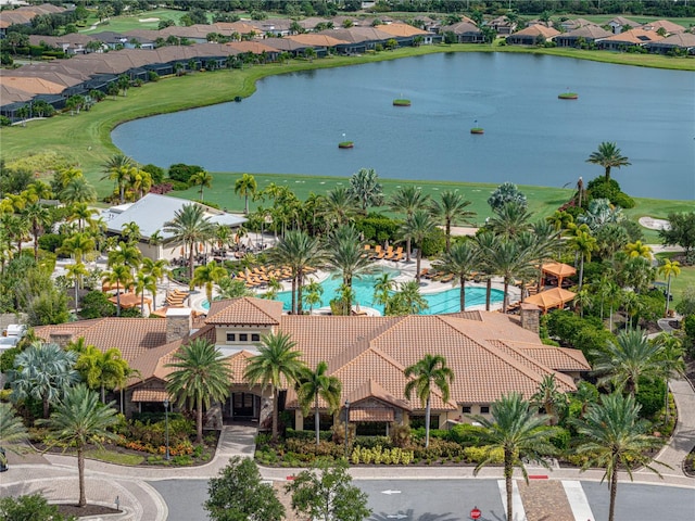 birds eye view of property with a water view