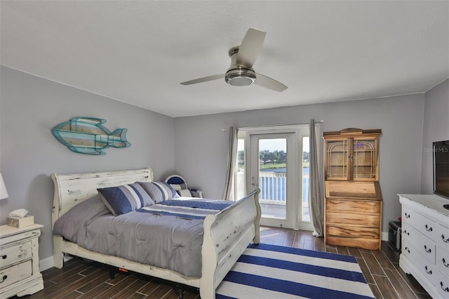 bedroom with ceiling fan, dark hardwood / wood-style floors, and access to exterior