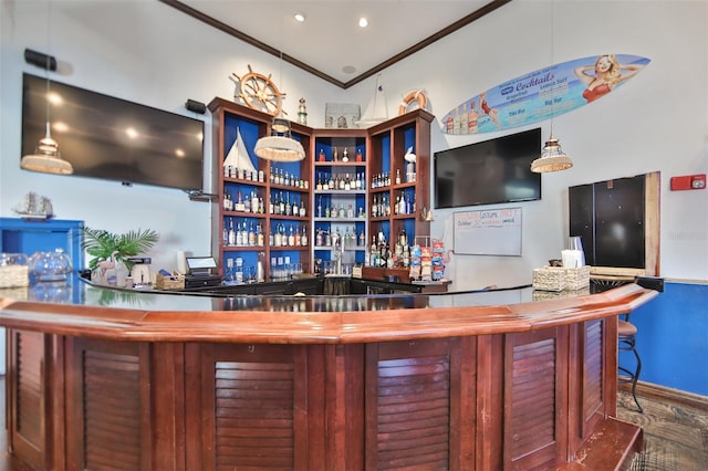 bar with hardwood / wood-style floors and ornamental molding