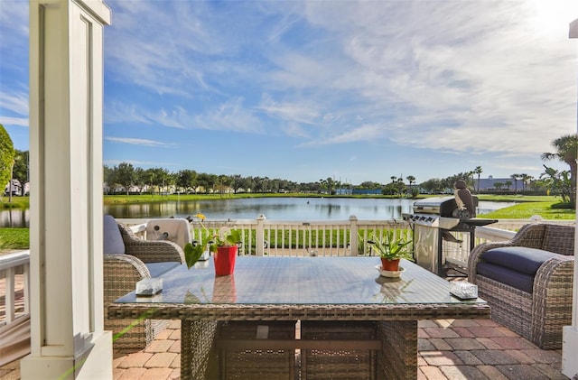 view of patio with a water view