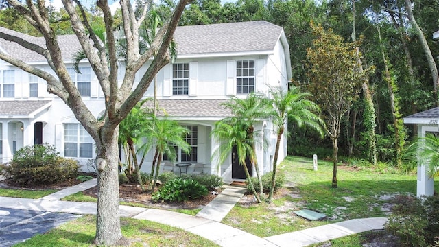 view of front of property with a front lawn