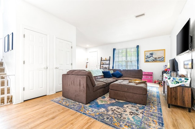 living room with light hardwood / wood-style floors