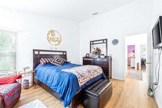 bedroom with light wood-type flooring