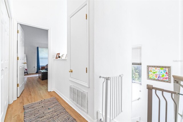 corridor featuring light hardwood / wood-style flooring