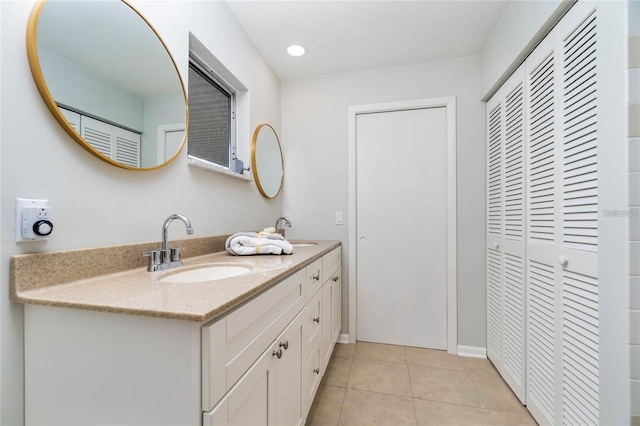 bathroom with tile patterned floors and vanity