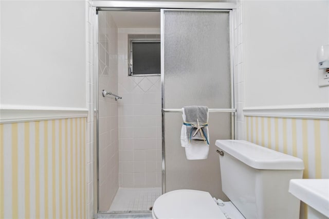 bathroom with toilet and walk in shower