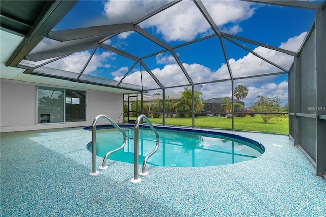 view of swimming pool featuring a lawn and glass enclosure