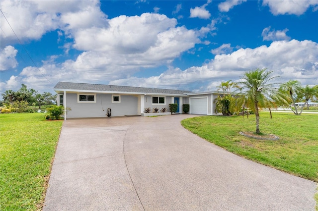 ranch-style house with a garage and a front lawn