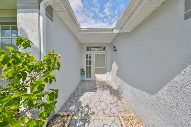 902 Mcdaniel St Unit 1, Sun City Center, FL 33573 - doorway to property featuring stucco siding