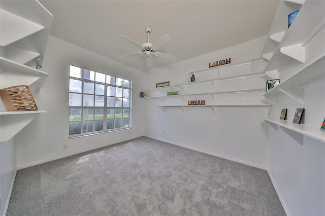 carpeted empty room with ceiling fan