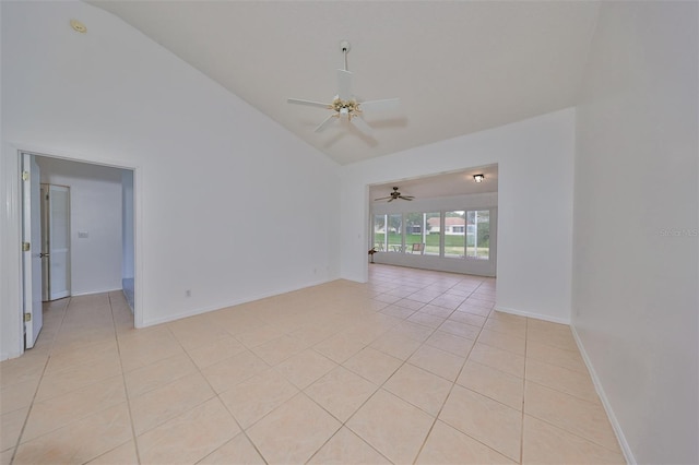 unfurnished room featuring light tile patterned flooring, high vaulted ceiling, and ceiling fan