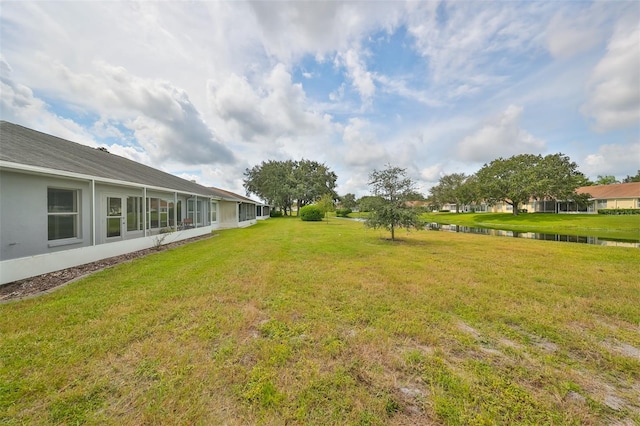 902 Mcdaniel St Unit 1, Sun City Center, FL 33573 - view of green lawn featuring a water view