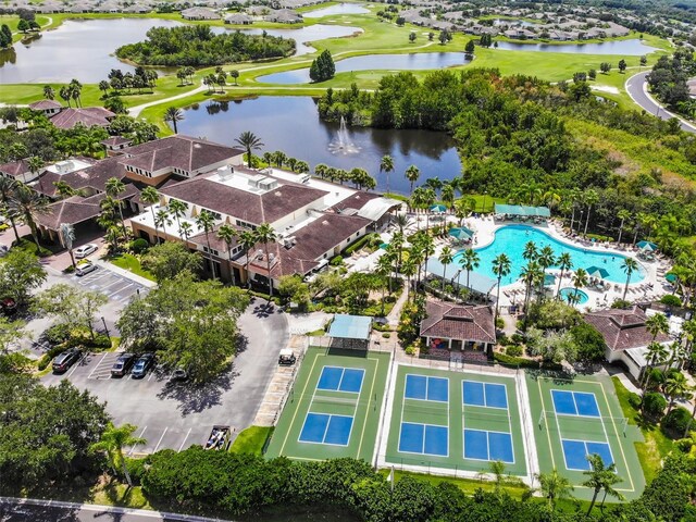 902 Mcdaniel St Unit 1, Sun City Center, FL 33573 - bird's eye view of a pool area, a large body of water, and a local golf course