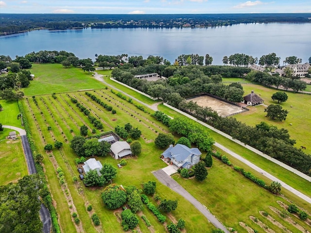 birds eye view of property with a rural view and a water view