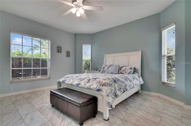 bedroom with light tile patterned floors and ceiling fan