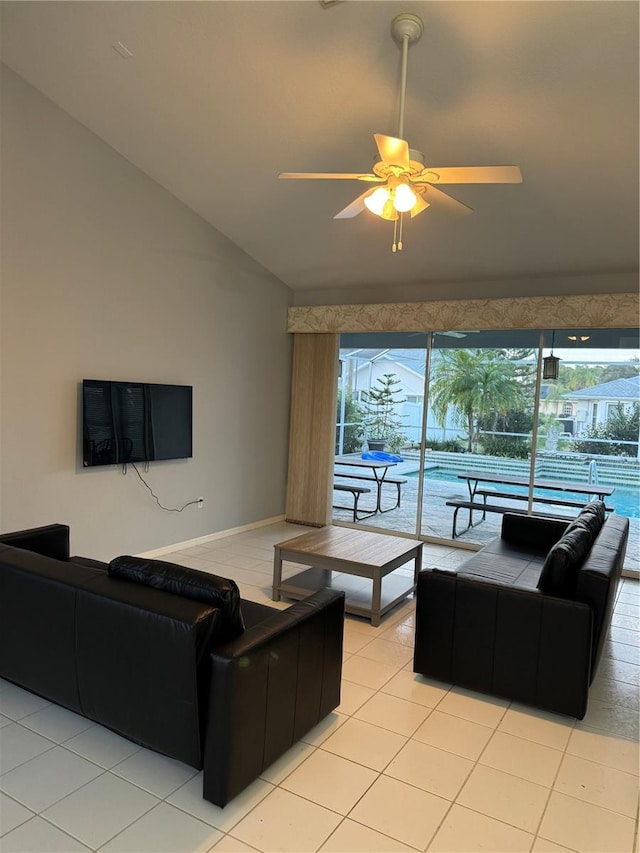 living room with ceiling fan, a wealth of natural light, and light tile patterned floors