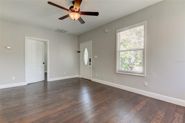 unfurnished room with ceiling fan and dark hardwood / wood-style floors