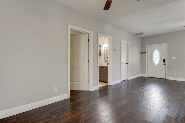 foyer entrance with sink, ceiling fan, and dark hardwood / wood-style floors