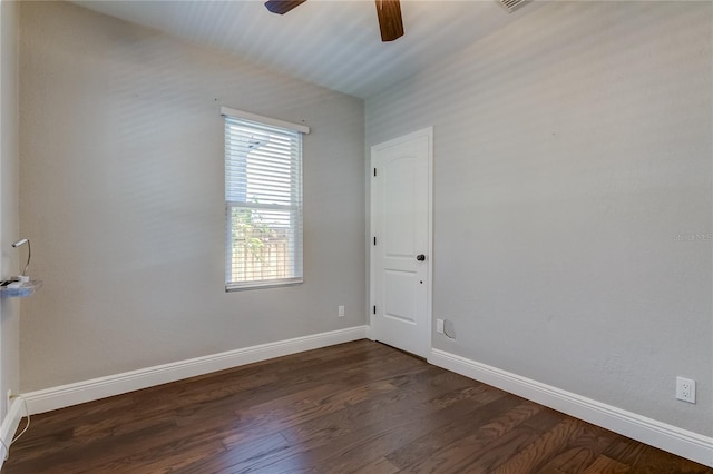 empty room featuring ceiling fan and dark hardwood / wood-style floors