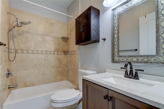 full bathroom featuring vanity, toilet, and tiled shower / bath