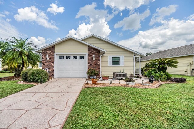 view of front of property with a front lawn and a garage