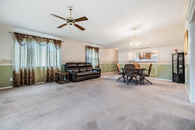 living room featuring crown molding, ceiling fan with notable chandelier, and light colored carpet