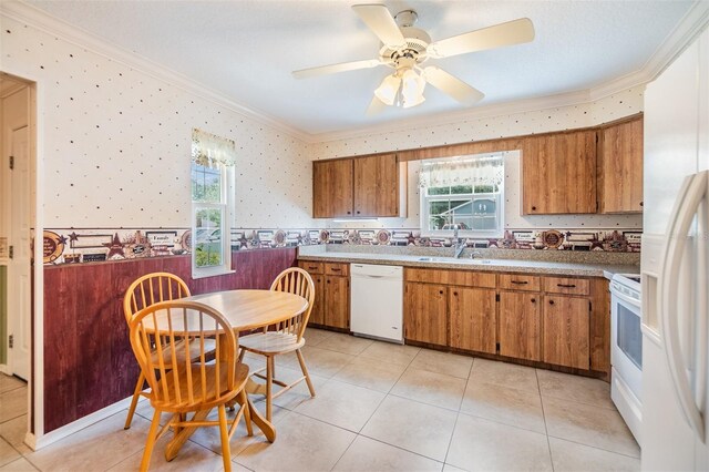 kitchen with white appliances, light tile patterned floors, and plenty of natural light