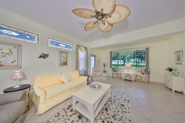 tiled living room with ceiling fan