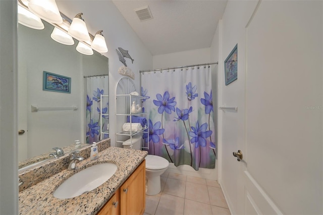 bathroom with tile patterned floors, a textured ceiling, vanity, curtained shower, and toilet