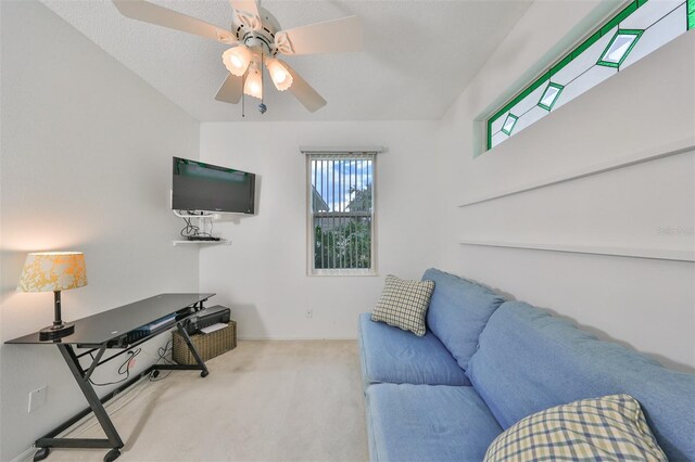 living room featuring ceiling fan and carpet flooring