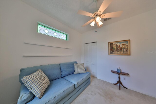 living room with ceiling fan and light carpet