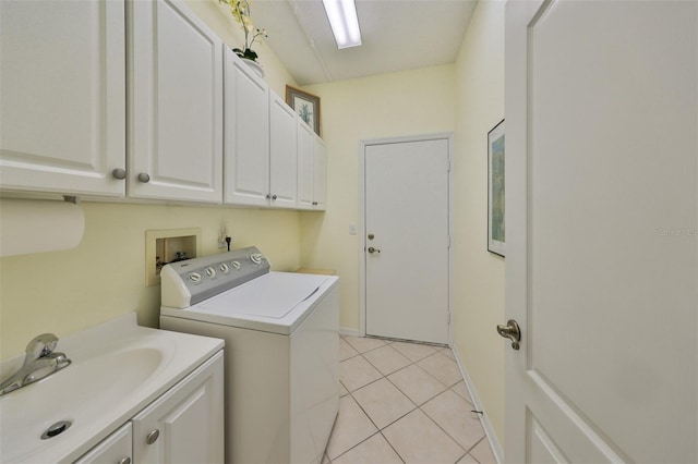 laundry area featuring sink, light tile patterned flooring, cabinets, and washer and dryer