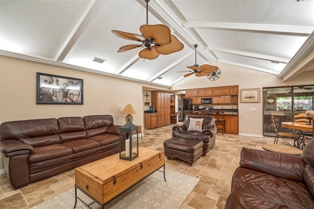 living room featuring vaulted ceiling with beams and ceiling fan