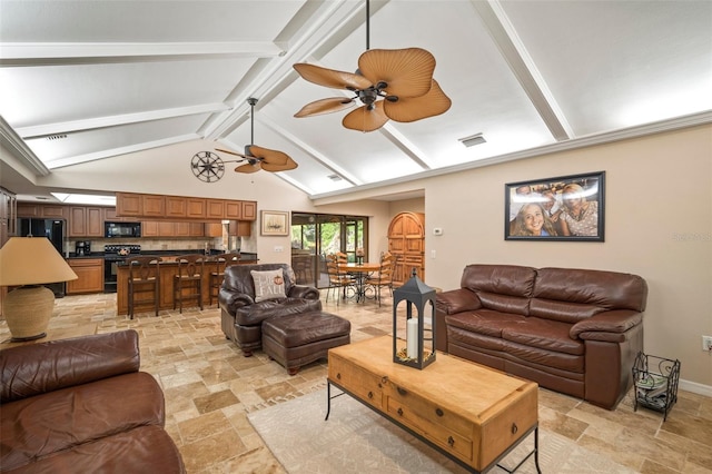 living room with vaulted ceiling with beams and ceiling fan