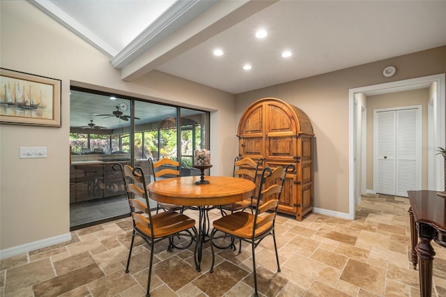 dining room featuring ceiling fan and lofted ceiling