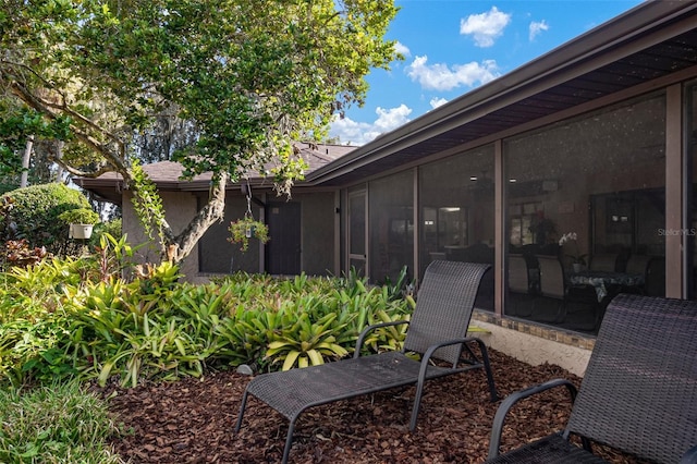 exterior space featuring a sunroom