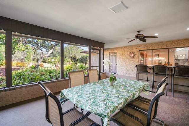 sunroom with ceiling fan