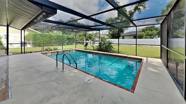 view of swimming pool featuring a lawn, a patio area, a lanai, and a fenced in pool