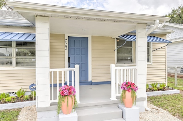 doorway to property featuring a porch