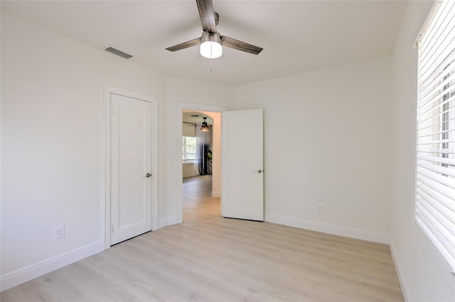 unfurnished bedroom with light hardwood / wood-style flooring and ceiling fan