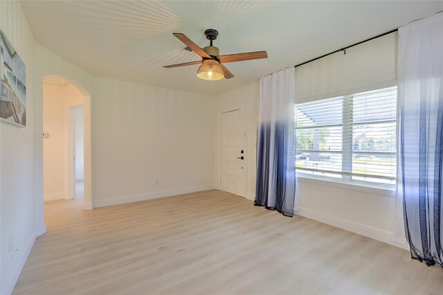 spare room featuring ceiling fan and light hardwood / wood-style floors