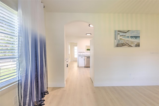 hallway with light hardwood / wood-style flooring